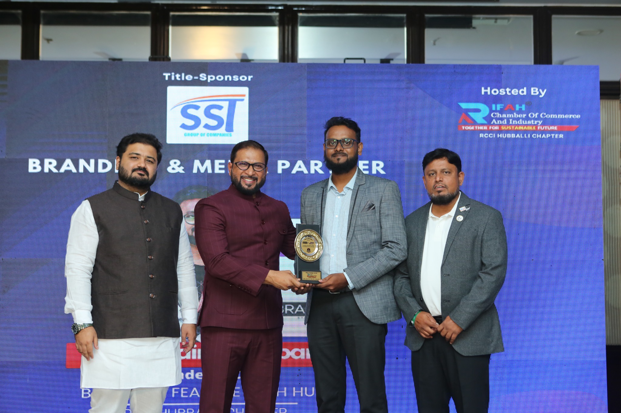 Hunain Bagaban receiving business recognition